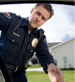 policeman-reaching-into-car_100227286_s.jpg